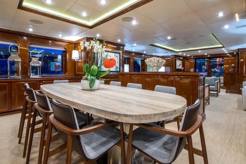  Yacht Photos Pics Luxurious yacht interior with elegant dining area, modern decor, and wooden finishes, CMN Custom 2002.