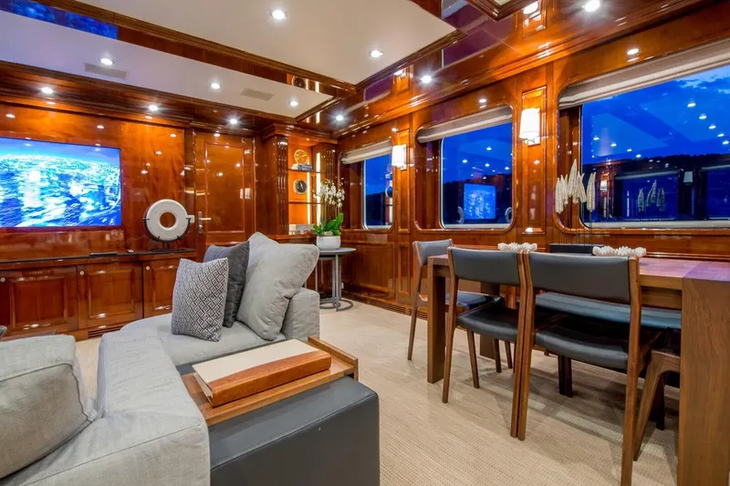  Yacht Photos Pics Luxurious yacht interior with elegant wood paneling, modern furniture, and ambient lighting, CMN Custom 2002.