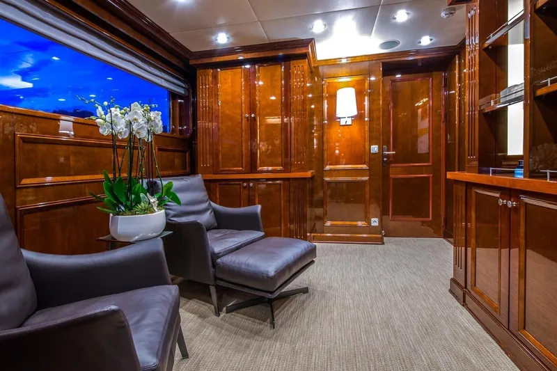  Yacht Photos Pics Luxurious yacht interior with leather chairs, wooden paneling, and elegant decor, CMN Custom 2002.