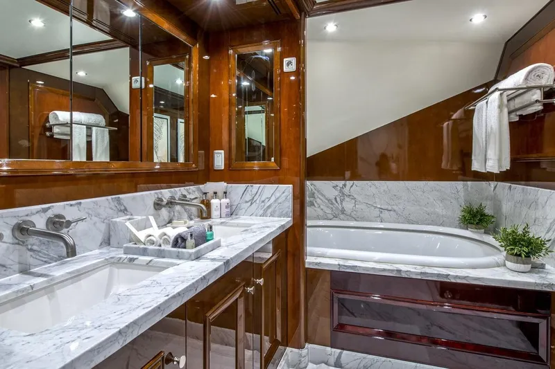  Yacht Photos Pics Luxurious yacht bathroom with marble countertops and bathtub, CMN Custom 2002 model.