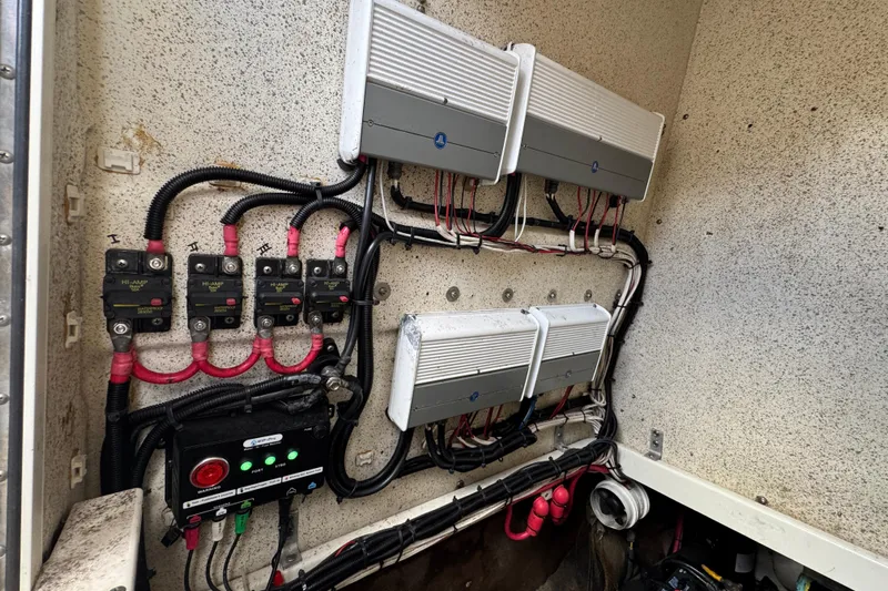  Yacht Photos Pics Electrical system of a 2006 Hydra-Sports Vector 3300 VX boat, featuring wiring and circuit breakers.