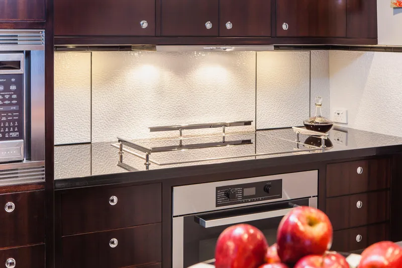  Yacht Photos Pics Luxurious kitchen in 2013 Nordhavn 68 yacht with modern appliances and elegant design.