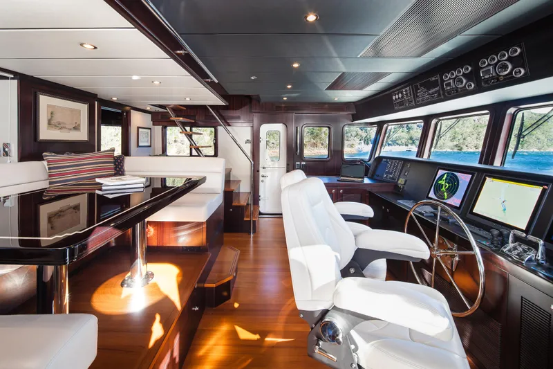  Yacht Photos Pics Luxurious 2013 Nordhavn 68 yacht interior with modern navigation equipment and elegant seating.