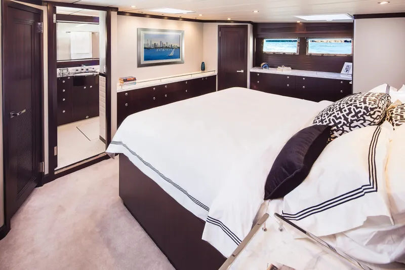  Yacht Photos Pics Luxurious bedroom interior on 2013 Nordhavn 68 yacht, featuring elegant decor and ample natural light.