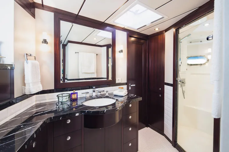 Yacht Photos Pics Luxurious bathroom in 2013 Nordhavn 68 yacht with elegant dark wood and marble finishes.
