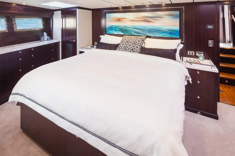  Yacht Photos Pics Luxurious bedroom interior on 2013 Nordhavn 68 yacht with elegant bedding and ocean view.