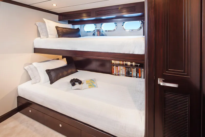  Yacht Photos Pics Luxurious Nordhavn 68 yacht cabin with bunk beds and bookshelf, 2013 model.