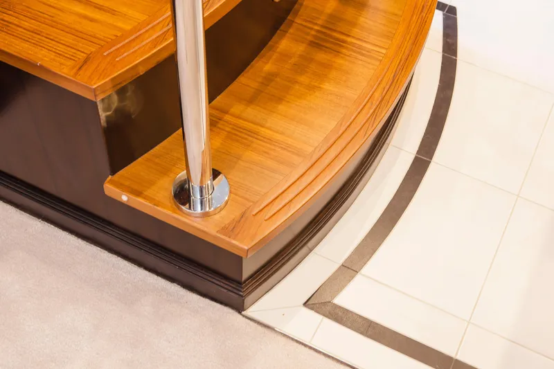  Yacht Photos Pics Polished wooden steps with metal railing on 2013 Nordhavn 68 yacht interior.