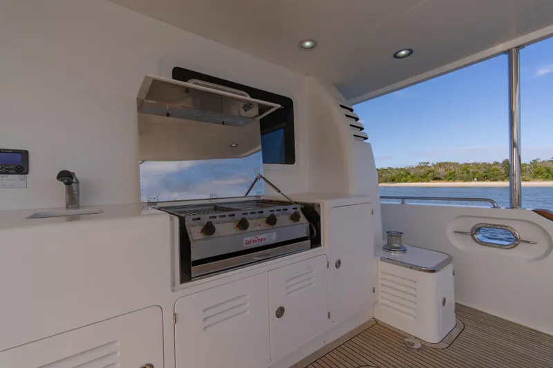  Yacht Photos Pics Outdoor kitchen on 2013 Nordhavn 68 yacht with grill and ocean view.