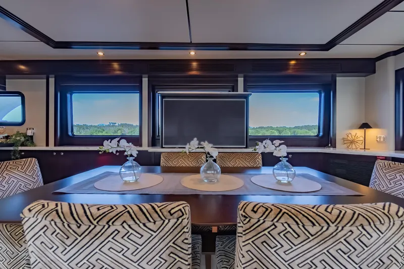  Yacht Photos Pics Luxurious interior of 2013 Nordhavn 68 yacht with elegant dining area and scenic windows.