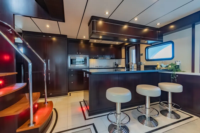  Yacht Photos Pics Luxurious 2013 Nordhavn 68 yacht interior with modern kitchen and stylish bar stools.