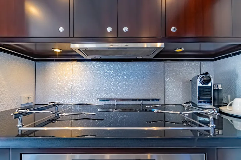  Yacht Photos Pics Luxurious kitchen in 2013 Nordhavn 68 yacht with modern appliances and sleek design.