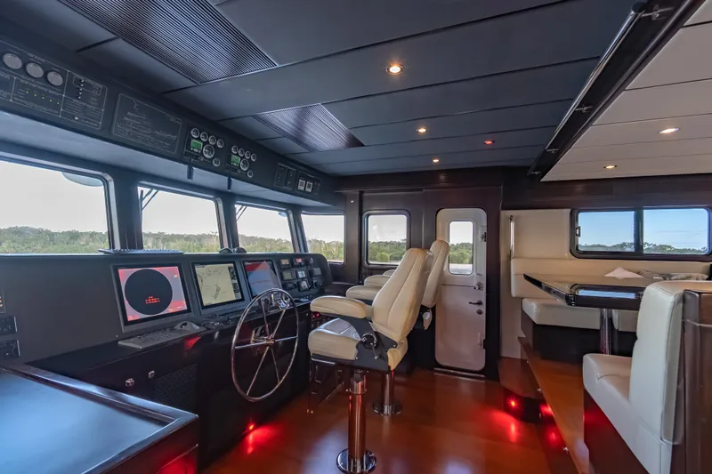  Yacht Photos Pics Pilothouse of 2013 Nordhavn 68 yacht with navigation equipment and seating.