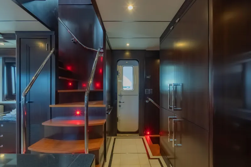  Yacht Photos Pics Luxurious interior of 2013 Nordhavn 68 yacht with elegant staircase and modern design.