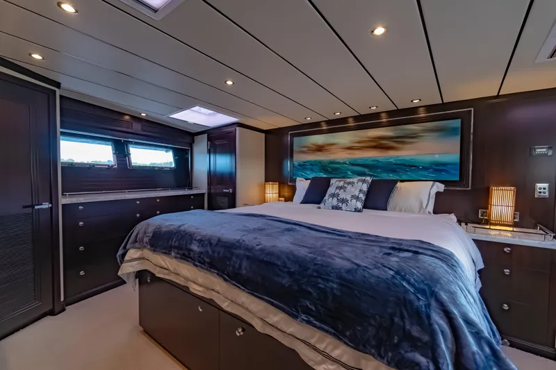  Yacht Photos Pics Luxurious bedroom interior of 2013 Nordhavn 68 yacht with elegant decor and ambient lighting.