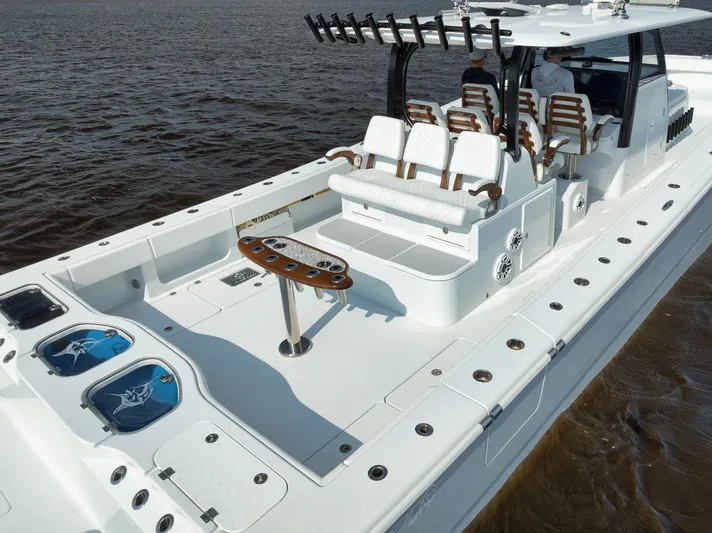  Yacht Photos Pics 2023 Freeman 47 boat with spacious deck and seating on the water.