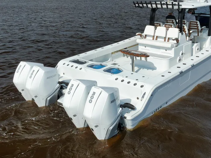  Yacht Photos Pics Freeman 47 boat, 2023 model, with triple Mercury outboard engines on water.