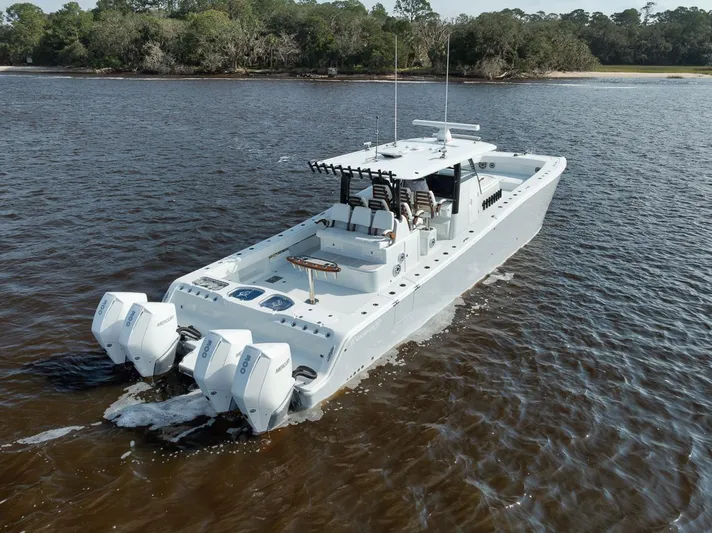  Yacht Photos Pics Freeman 47 boat cruising on water, 2023 model, with triple outboard engines.