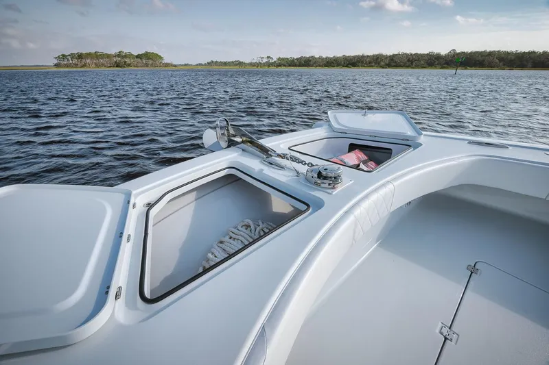  Yacht Photos Pics Freeman 47 boat deck with storage compartments, 2023 model, on calm water.