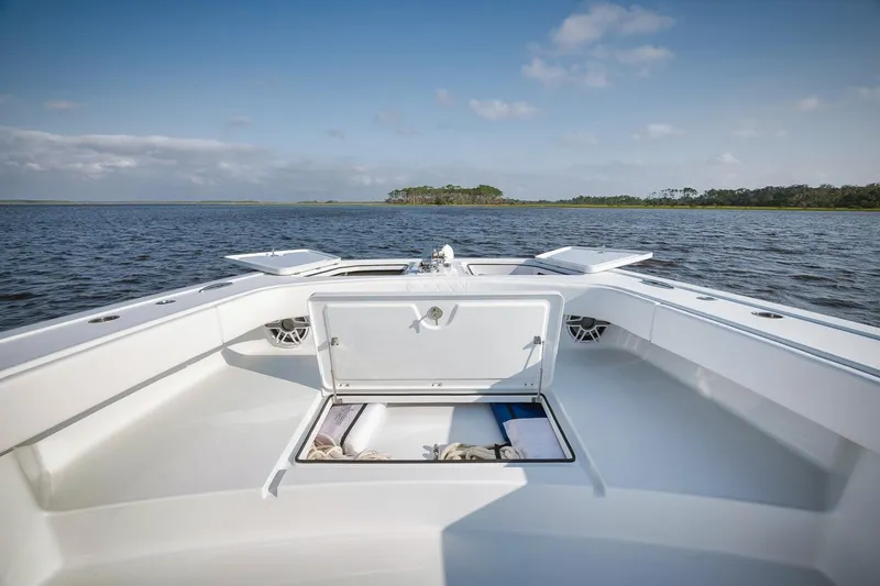  Yacht Photos Pics Freeman 47 boat deck with open storage, 2023 model, on calm water.