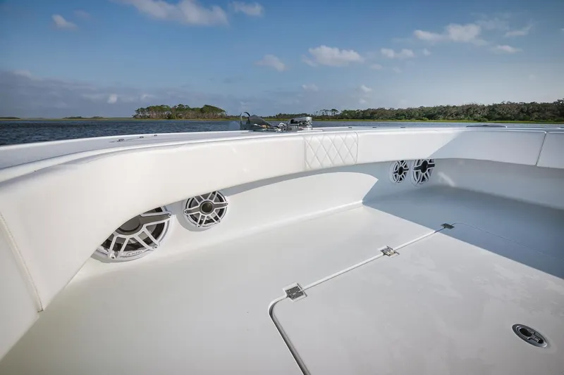  Yacht Photos Pics Freeman 47 boat deck with speakers, 2023 model, on a calm water backdrop.
