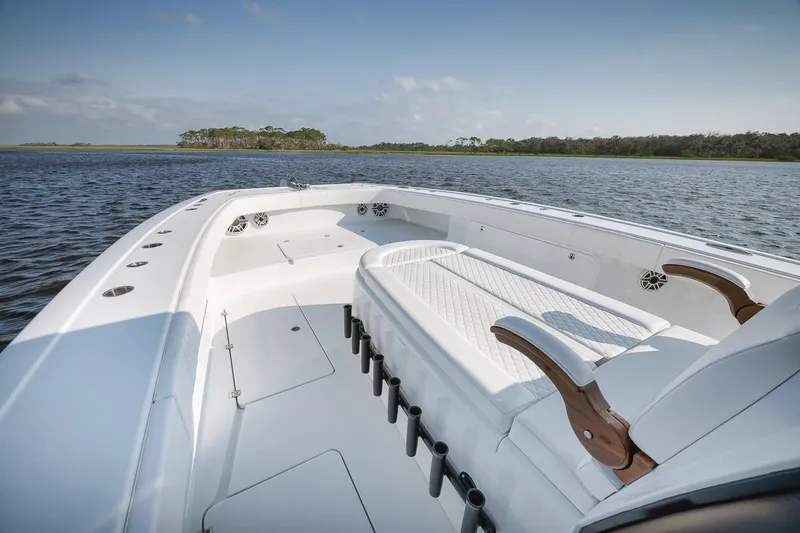  Yacht Photos Pics 2023 Freeman 47 boat interior on calm water, featuring spacious seating and sleek design.