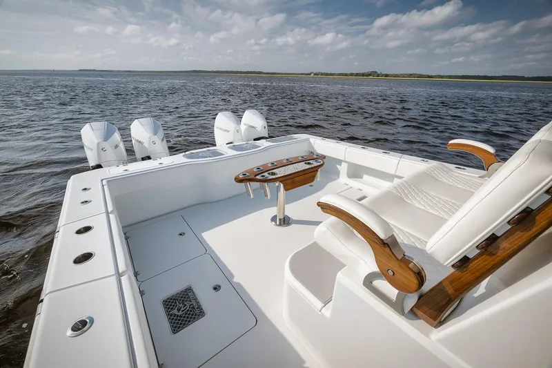  Yacht Photos Pics Freeman 47 boat deck with luxurious seating, 2023 model, on open water.