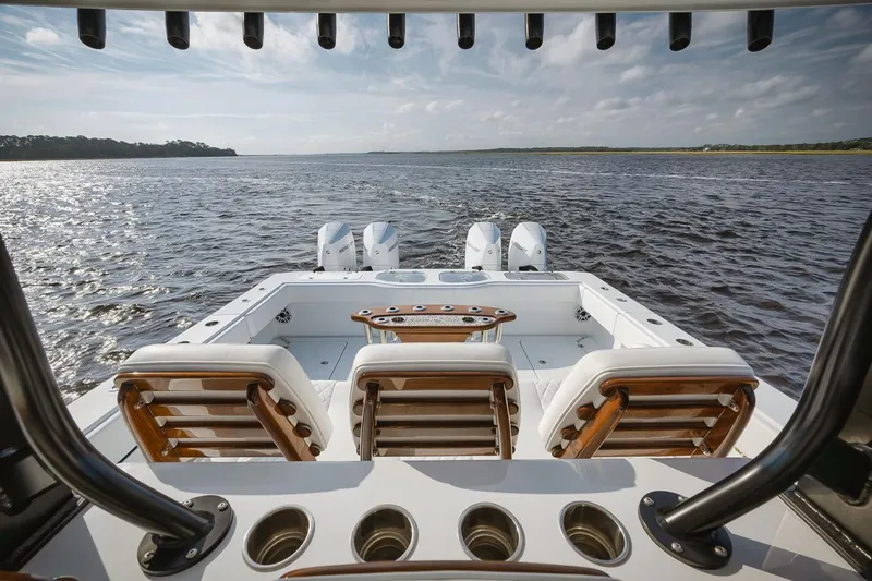  Yacht Photos Pics Freeman 47 boat, 2023 model, with luxurious seating and powerful engines on open water.