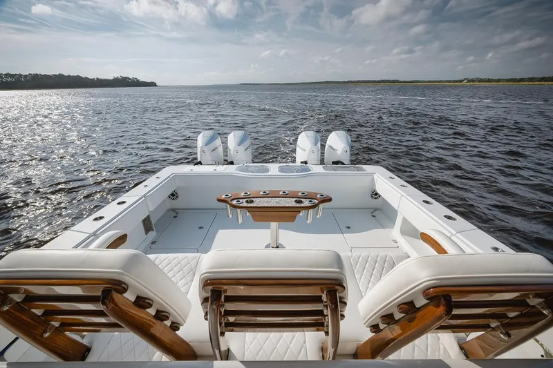  Yacht Photos Pics Freeman 47 boat, 2023 model, with luxurious seating and powerful engines on open water.
