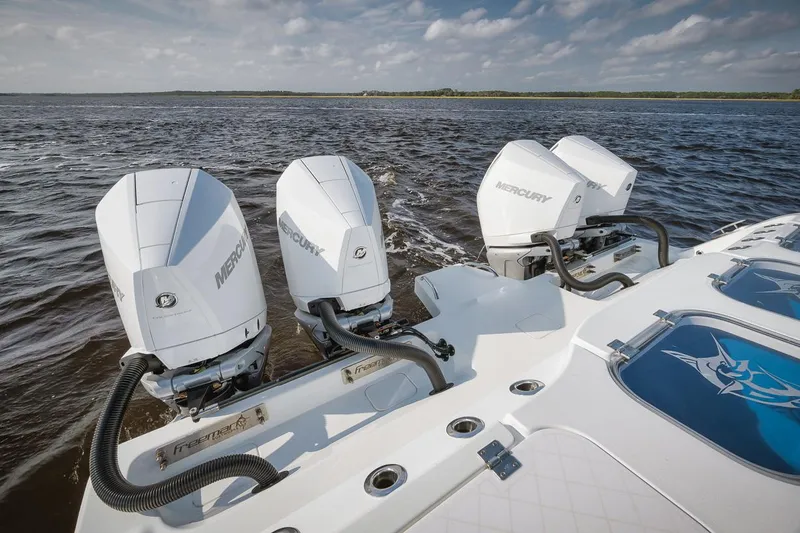  Yacht Photos Pics Freeman 47 boat with triple Mercury outboard engines on open water, 2023 model.