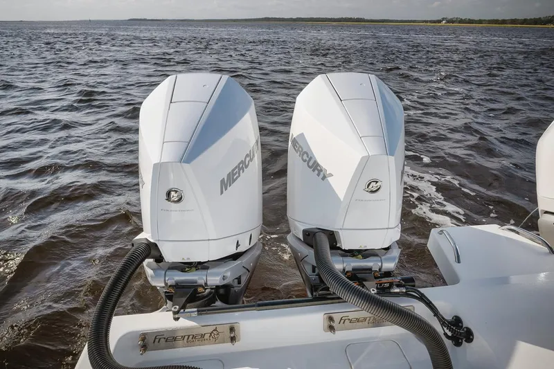 Yacht Photos Pics Freeman 47 boat with twin Mercury outboard engines on open water, 2023 model.
