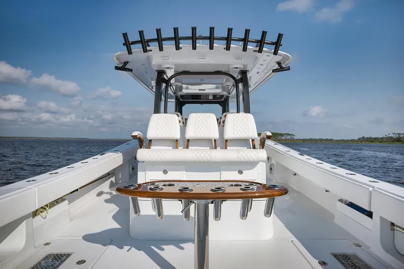  Yacht Photos Pics 2023 Freeman 47 boat interior with seating and rod holders on a sunny day.