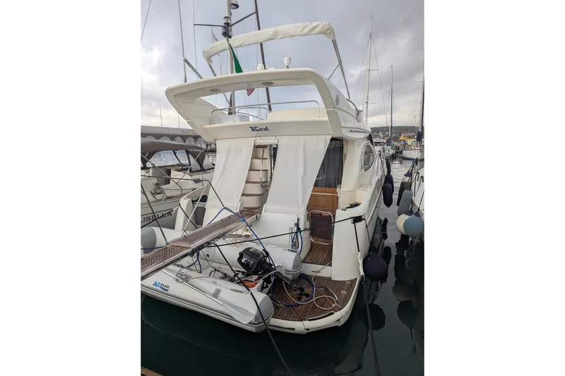  Yacht Photos Pics Azimut 46 yacht from 2000 docked at a marina, rear view.