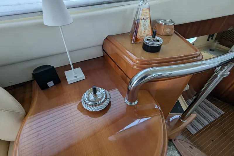  Yacht Photos Pics Interior of a 2000 Azimut 46 yacht with wooden table and accessories.