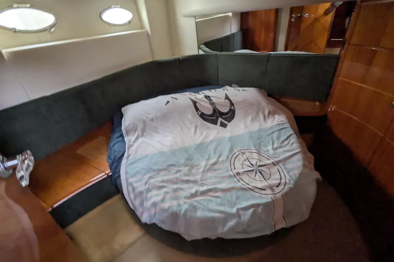  Yacht Photos Pics Cozy bedroom interior of 2000 Azimut 46 yacht with nautical-themed bedding.