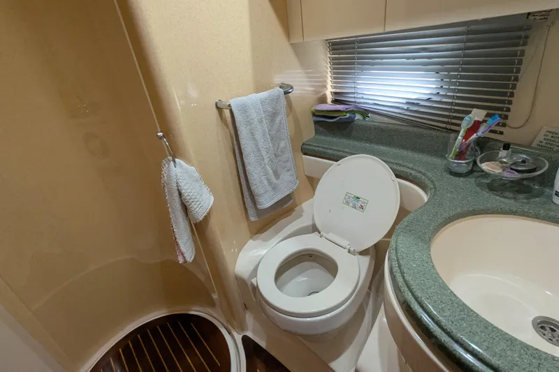  Yacht Photos Pics Bathroom interior of 2000 Azimut 46 yacht with toilet, sink, and shower.