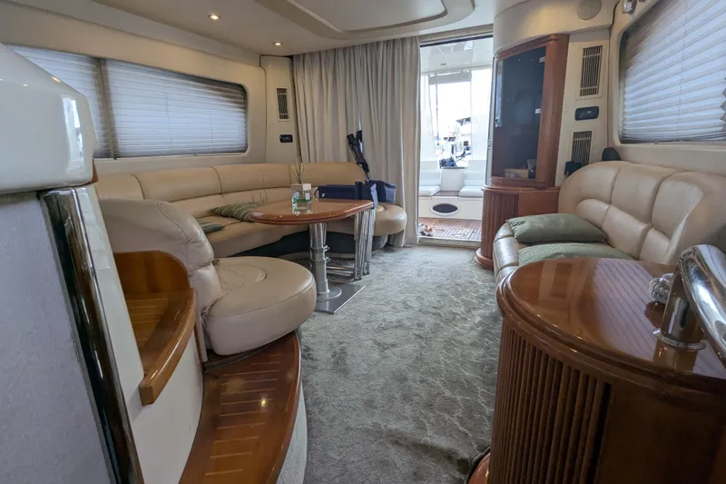  Yacht Photos Pics Luxurious interior of a 2000 Azimut 46 yacht with plush seating and elegant wood finishes.
