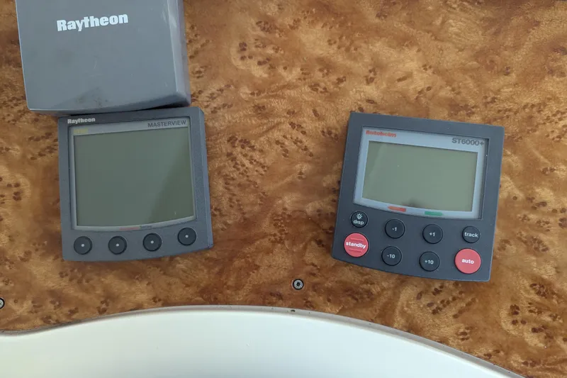  Yacht Photos Pics Raytheon and Autohelm navigation displays on 2000 Azimut 46 yacht dashboard.