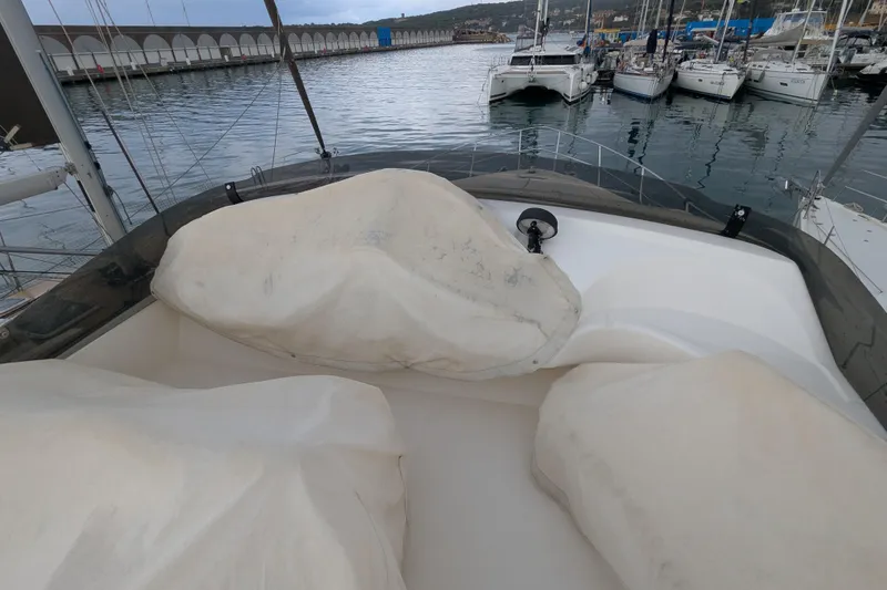  Yacht Photos Pics Azimut 46 yacht (2000) with covered seating, docked in a marina.