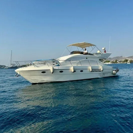  Yacht Photos Pics 2000 Azimut 46 yacht on calm blue waters under clear sky.