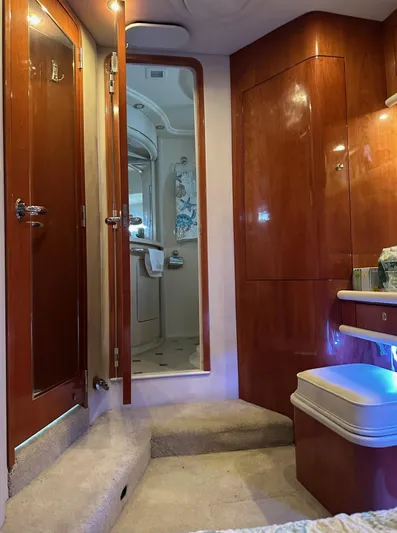  Yacht Photos Pics Interior of 2001 Sea Ray 560 Sedan Bridge yacht with wooden cabinetry and bathroom.