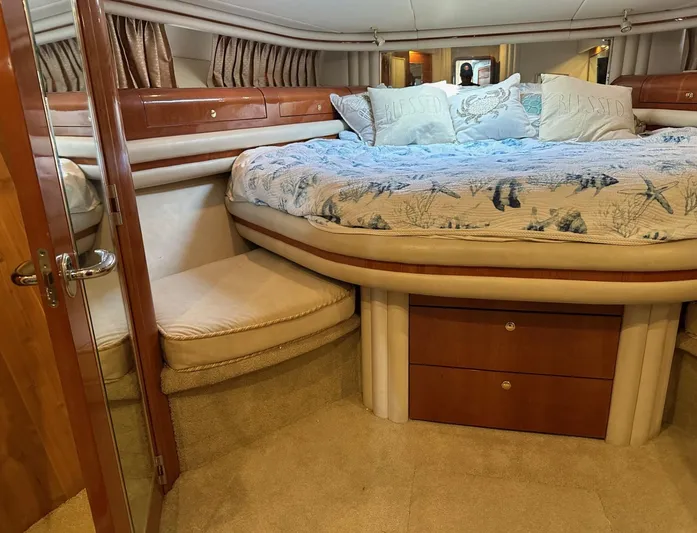  Yacht Photos Pics Luxurious bedroom interior of a 2001 Sea Ray 560 Sedan Bridge yacht.
