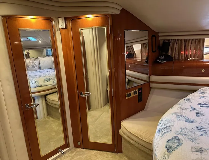  Yacht Photos Pics Luxurious interior of 2001 Sea Ray 560 Sedan Bridge yacht bedroom.