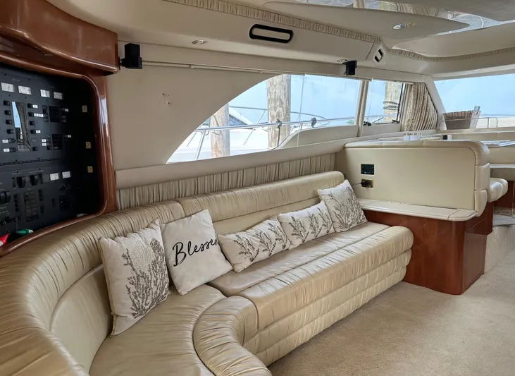  Yacht Photos Pics Luxurious interior of a 2001 Sea Ray 560 Sedan Bridge yacht with beige leather seating.