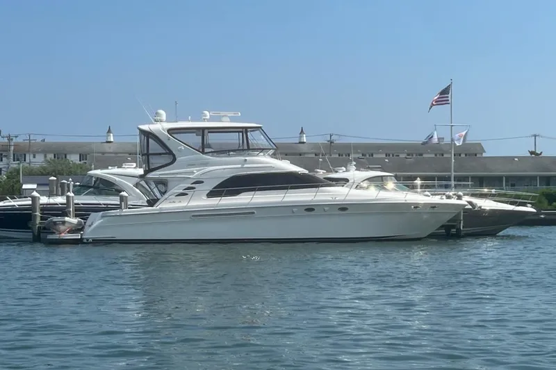  Yacht Photos Pics 2001 Sea Ray 560 Sedan Bridge yacht docked in a marina.
