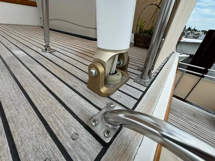 Carolina Breeze Yacht Photos Pics Deck detail of 1989 Grand Banks 42 Motor Yacht with metal fittings and wood finish.
