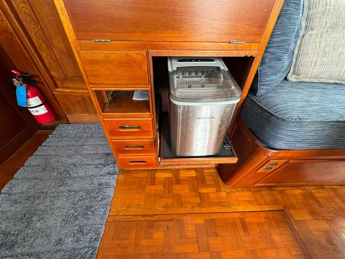 Carolina Breeze Yacht Photos Pics Interior of 1989 Grand Banks 42 Motor Yacht with wooden cabinetry and ice maker.