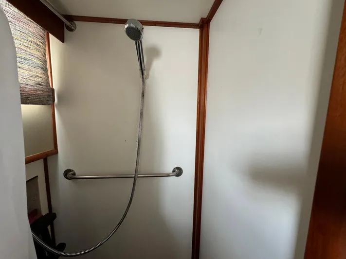 Carolina Breeze Yacht Photos Pics Shower area in 1989 Grand Banks 42 Motor Yacht with handheld showerhead.