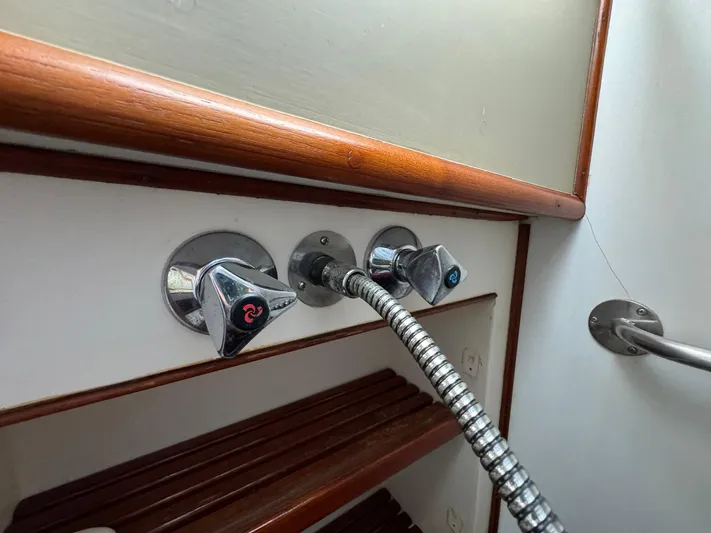 Carolina Breeze Yacht Photos Pics Shower controls on 1989 Grand Banks 42 Motor Yacht with wooden accents.