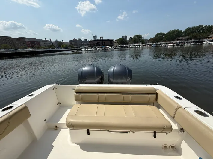 Savages Yacht Photos Pics 2015 Pursuit ST 310 Sport boat with twin engines on a calm river.